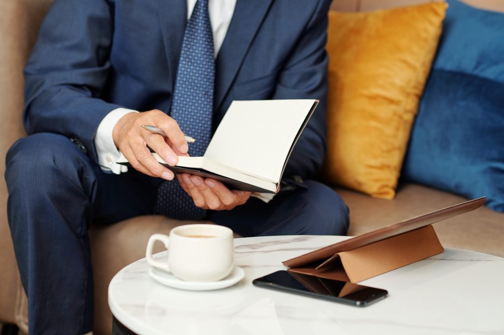 Businessman checking planner